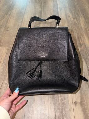 kate spade Black Pebbled Leather Tassel Backpack